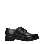 Black leather Church's oxford shoes and derbies, classic men's formal footwear with polished finish and lace-up design.