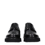 Black leather Church's oxford shoes and derbies displayed on a neutral background, showcasing classic craftsmanship and sleek design.