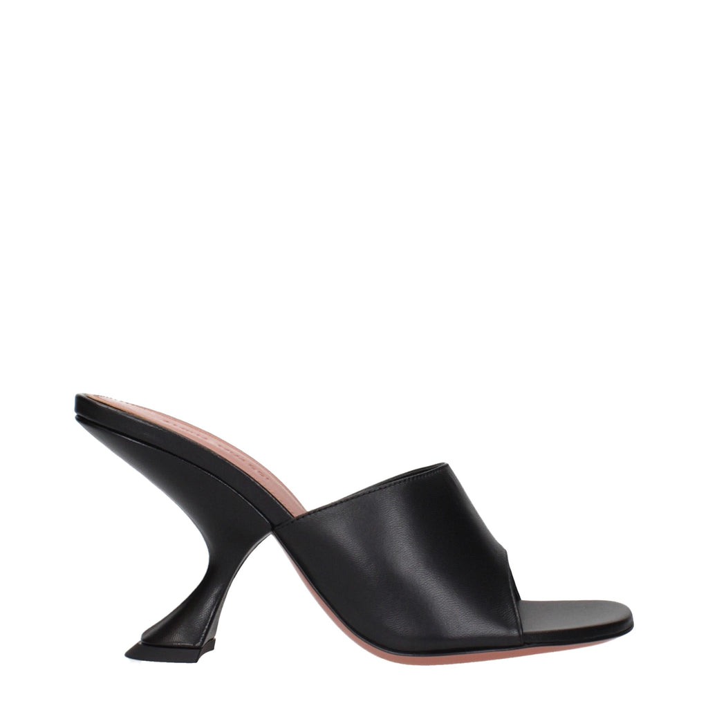Black leather stiletto heel sandals by Amina Muaddi, featuring sleek design and elegant straps for stylish footwear.