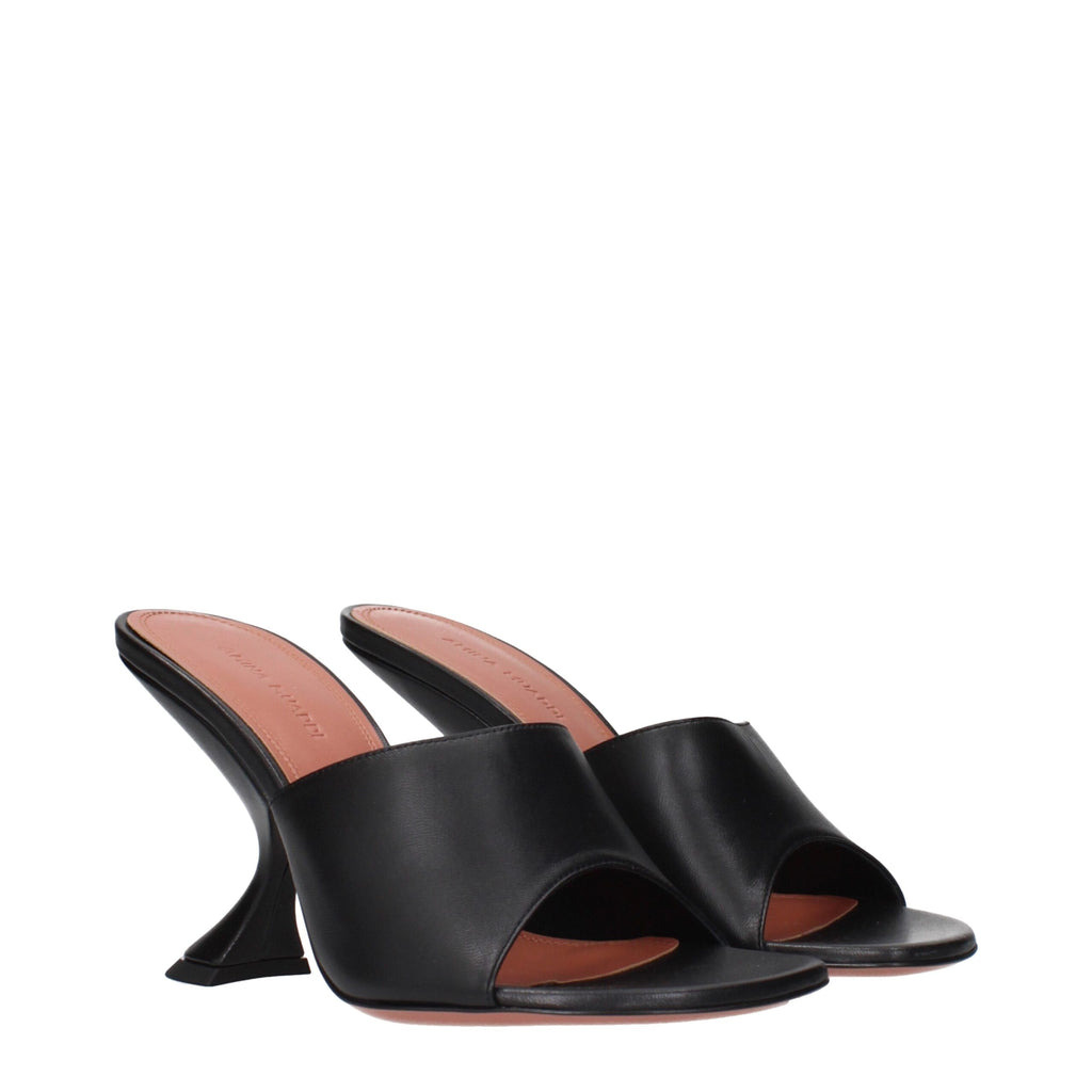 Amina Muaddi black leather stiletto heel sandals with ankle straps and sleek design, perfect for stylish evening wear.