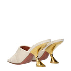 Amina Muaddi beige fabric slippers with slip-on design and plush interior for comfortable wear.