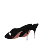 Black leather stiletto heel sandals by Amina Muaddi featuring sleek straps and elegant design.