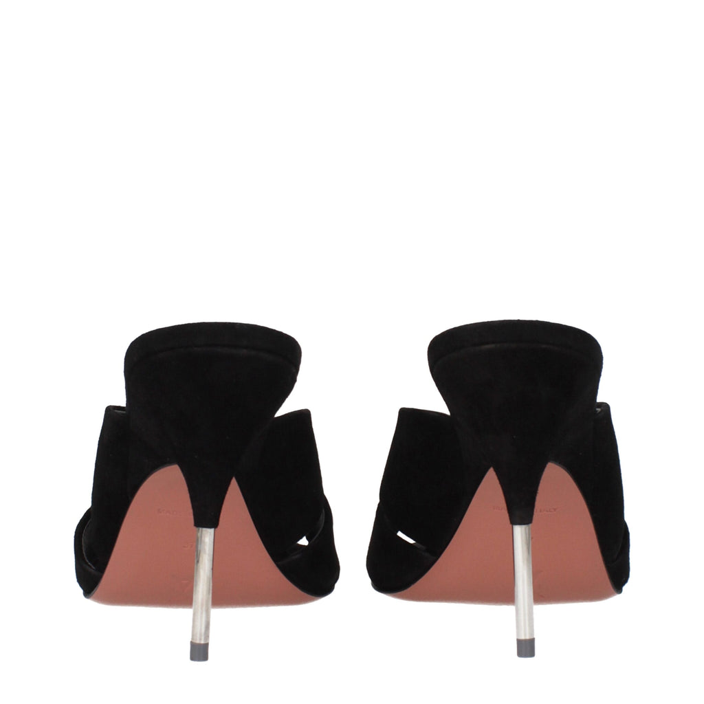 Black leather stiletto heel sandals by Amina Muaddi with sleek straps and elegant design.