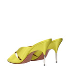 Amina Muaddi green satin stiletto heel sandals with ankle straps and pointed toes, showcasing elegant footwear design.
