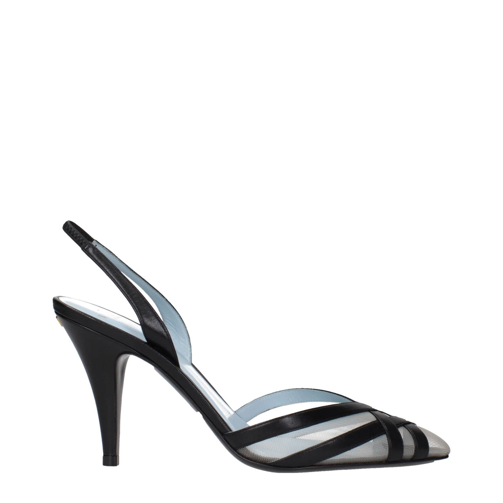 Black leather Valentino Garavani high heel pumps with pointed toes and stiletto heels, elegant footwear for formal occasions.