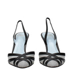 Black leather Valentino Garavani high heel pumps with sleek pointed toes and stiletto heels, stylish and elegant footwear for women.