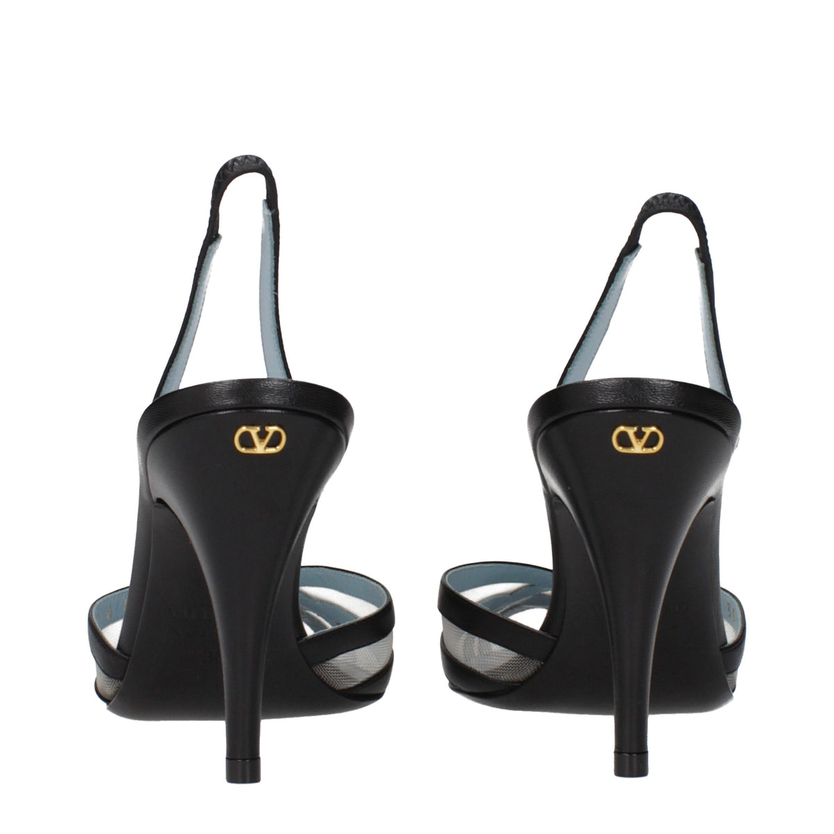 Black leather Valentino Garavani high heel pumps with pointed toes and stiletto heels, showcasing elegant craftsmanship.