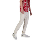 Beige cotton skinny jeans from Tommy Hilfiger Jeans with a classic fitted style and front pockets.