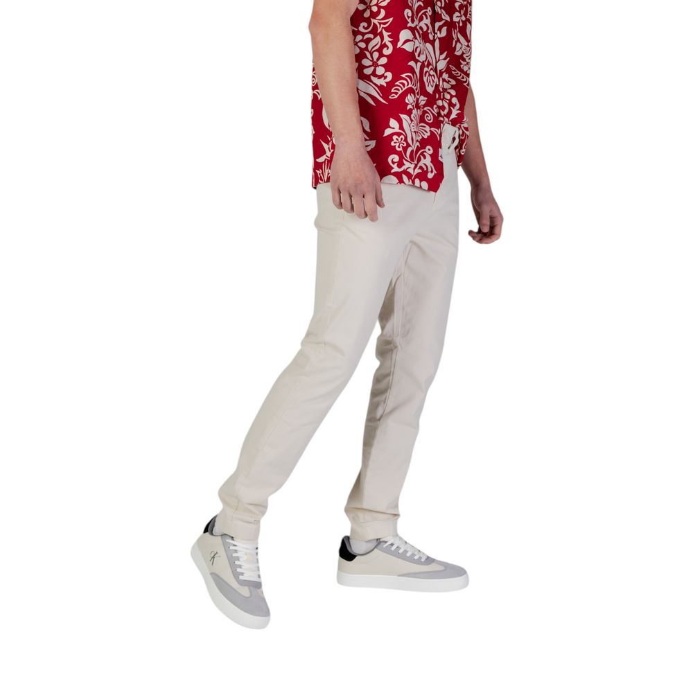Beige cotton skinny jeans from Tommy Hilfiger Jeans with a classic fitted style and front pockets.
