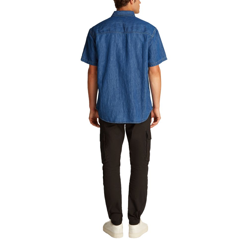 Calvin Klein Jeans blue denim shirt with button-down front and classic collar, casual style for men.