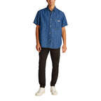 Calvin Klein Jeans blue denim shirt with button-front and classic collar, casual style for men.