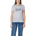 White cotton T-shirt by EA7 Emporio Armani, featuring a classic fit and subtle logo detail on the chest.