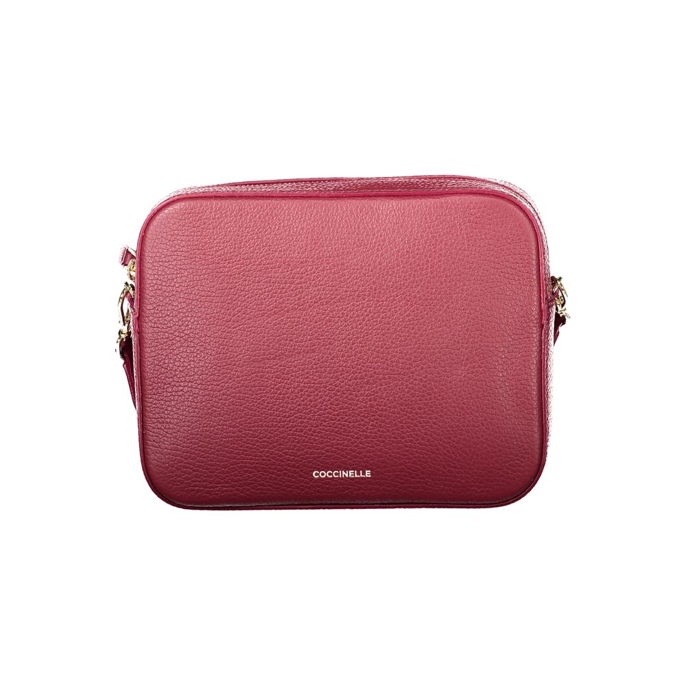 Red leather Coccinelle women’s bag with sleek design and silver hardware, featuring a top handle and adjustable shoulder strap.
