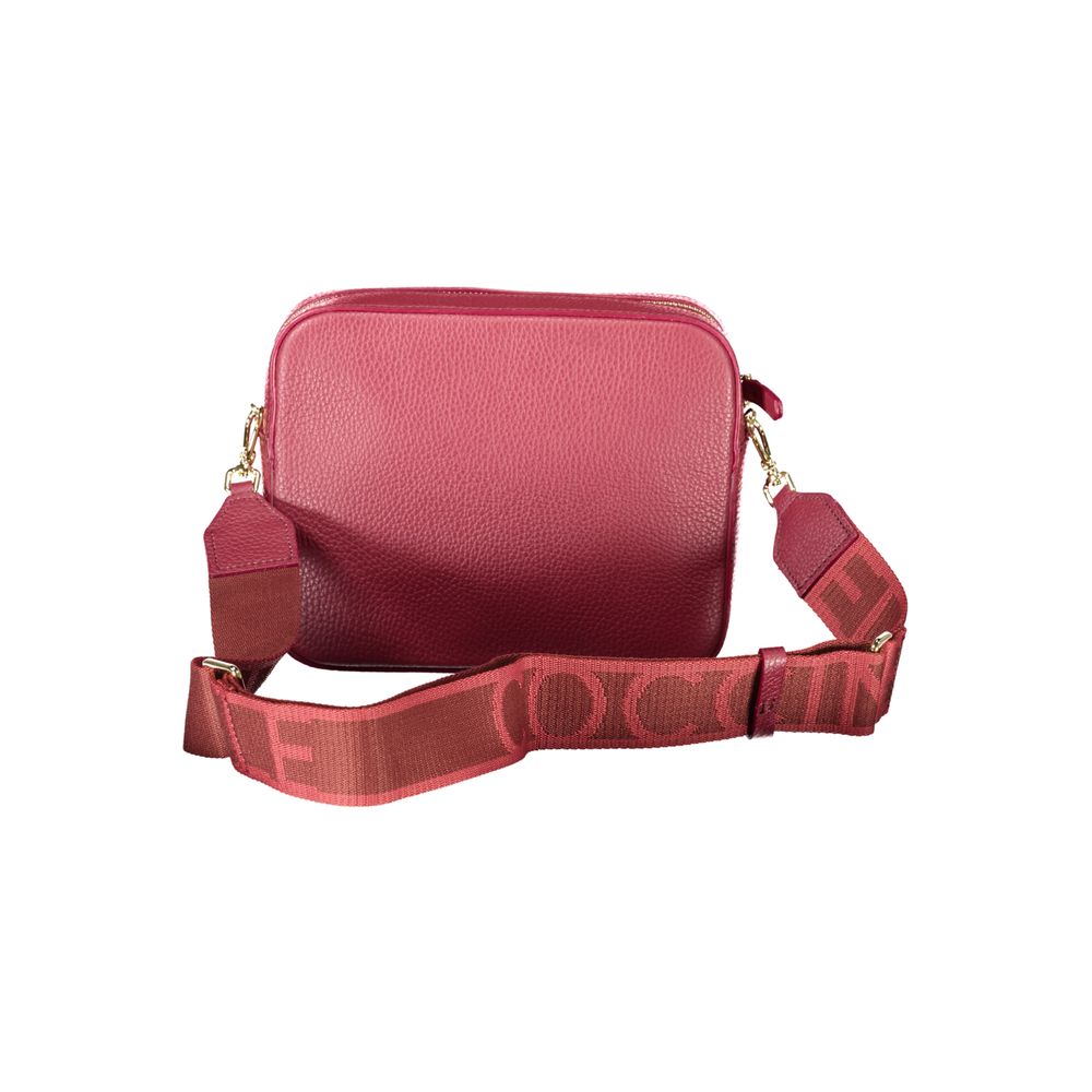 Red leather women's bag by Coccinelle with a sleek design and top handle, showcasing elegant craftsmanship and stylish details.