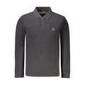 Black cotton men's polo shirt by Timberland, featuring a classic collar and short sleeves, displayed flat on a plain background.