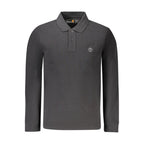 Black cotton men's polo shirt by Timberland, featuring a classic collar and short sleeves, displayed flat on a plain background.
