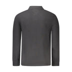 Black Timberland men's cotton polo shirt with a classic collar and short sleeves, displayed on a plain background.