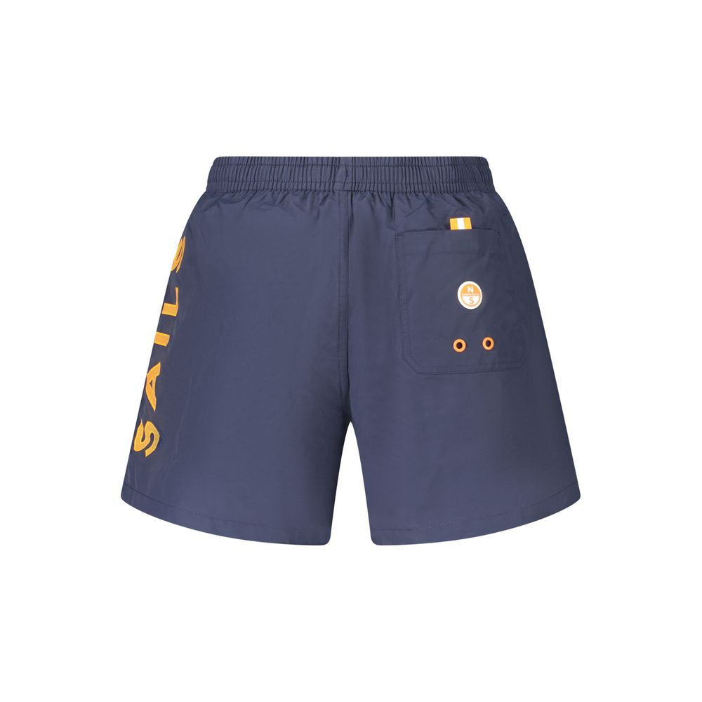 North Sails blue nylon men's swim trunks laid flat, showcasing the lightweight fabric and classic design for beach or pool wear.