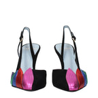 Black leather high heel pumps by Valentino Garavani with pointed toes and sleek design.