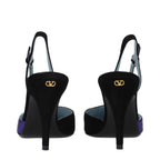 Black leather high heel pumps by Valentino Garavani, featuring sleek design and pointed toes.