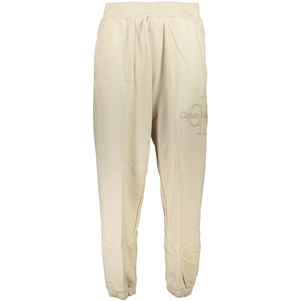 Beige cotton men's sweatpants by Calvin Klein, featuring a relaxed fit and elastic waistband, ideal for casual wear.