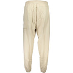 Beige cotton men's sweatpants by Calvin Klein, comfortable casual clothing with elastic waistband and relaxed fit.