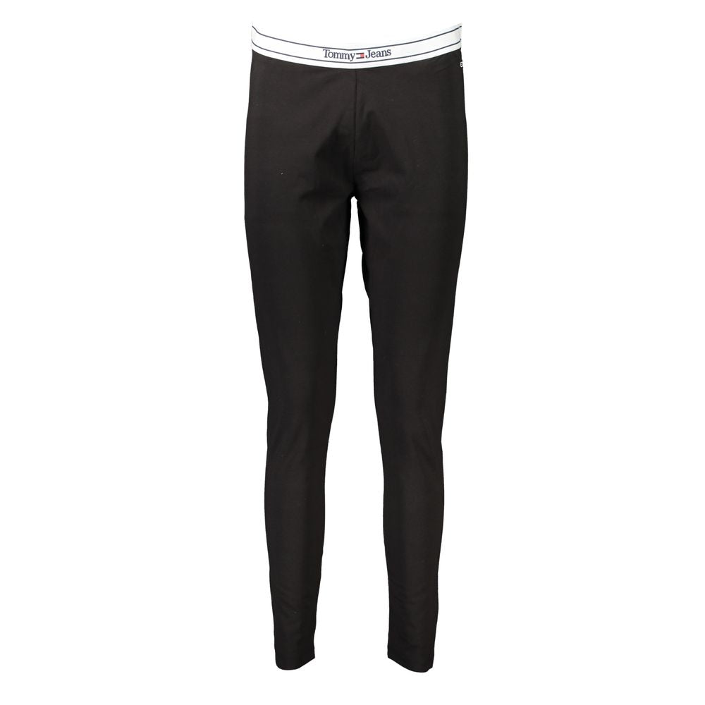 Black cotton women's leggings by Tommy Hilfiger, close-up view showing the stretchy fabric and waistband detail.