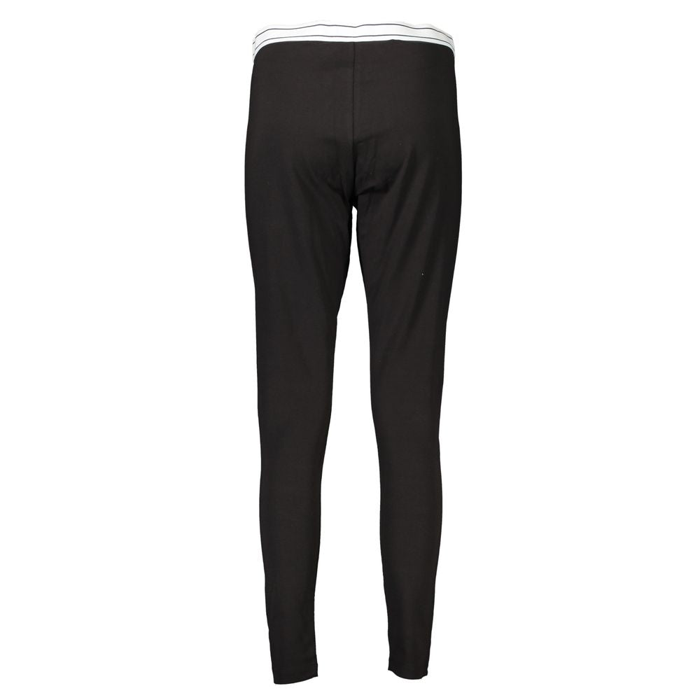 Black cotton women's leggings by Tommy Hilfiger, close-up view showing comfortable fit and smooth fabric texture.