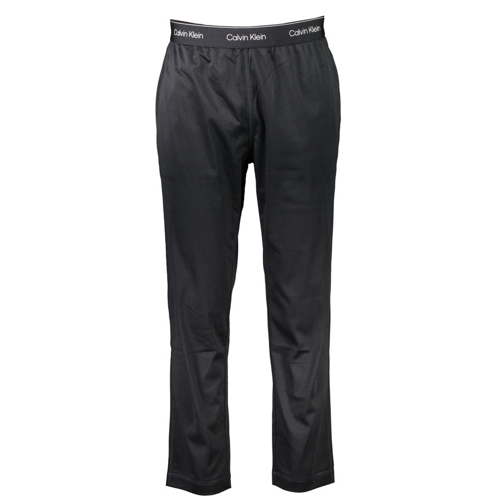 Calvin Klein men's black polyester track pants with a relaxed fit and elastic waistband, suitable for athletic or casual wear.
