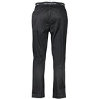 Calvin Klein black polyester men's track pants with elastic waistband and side pockets, casual athletic wear.
