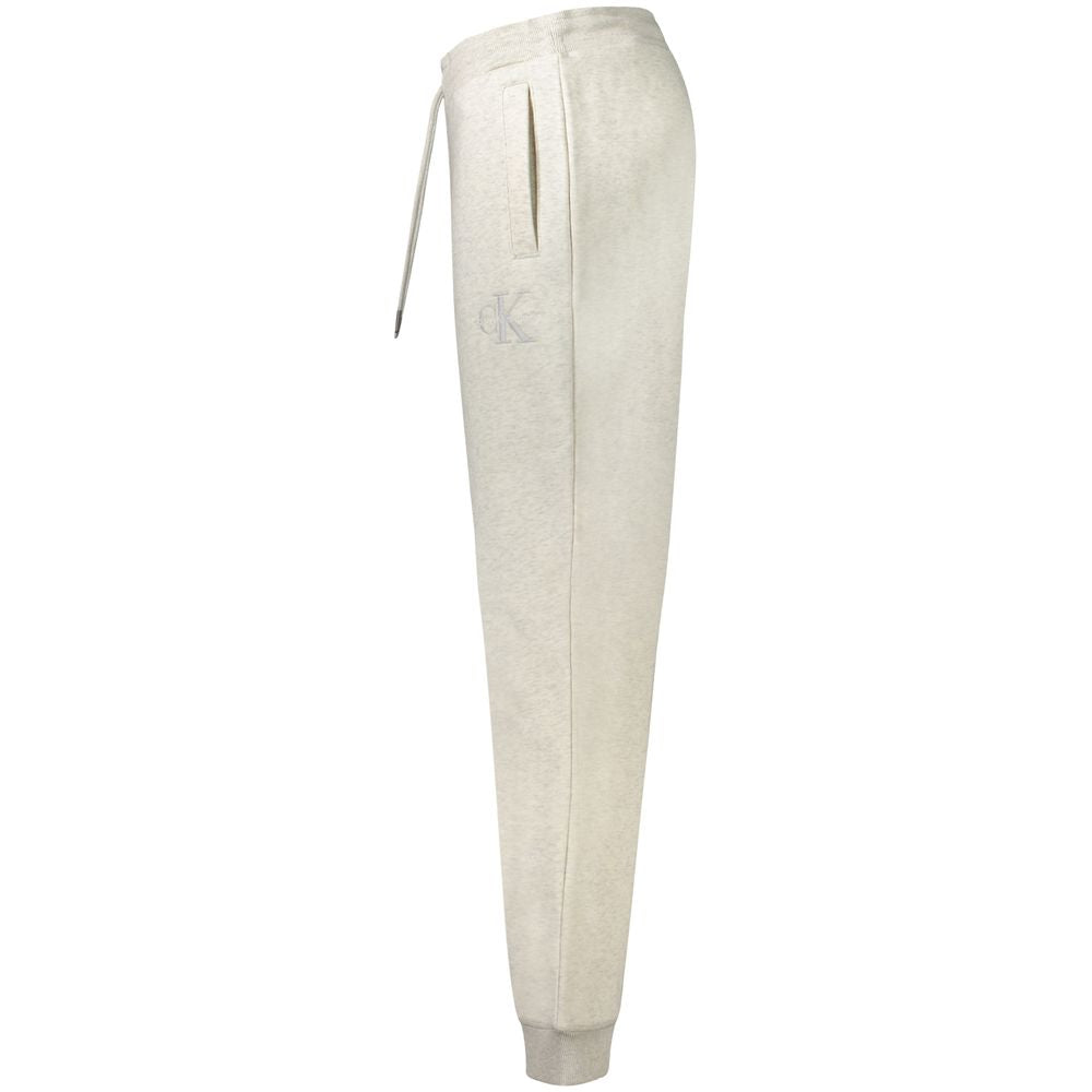 Calvin Klein men's grey cotton jogger pants with elastic waistband and tapered fit, casual athletic style.