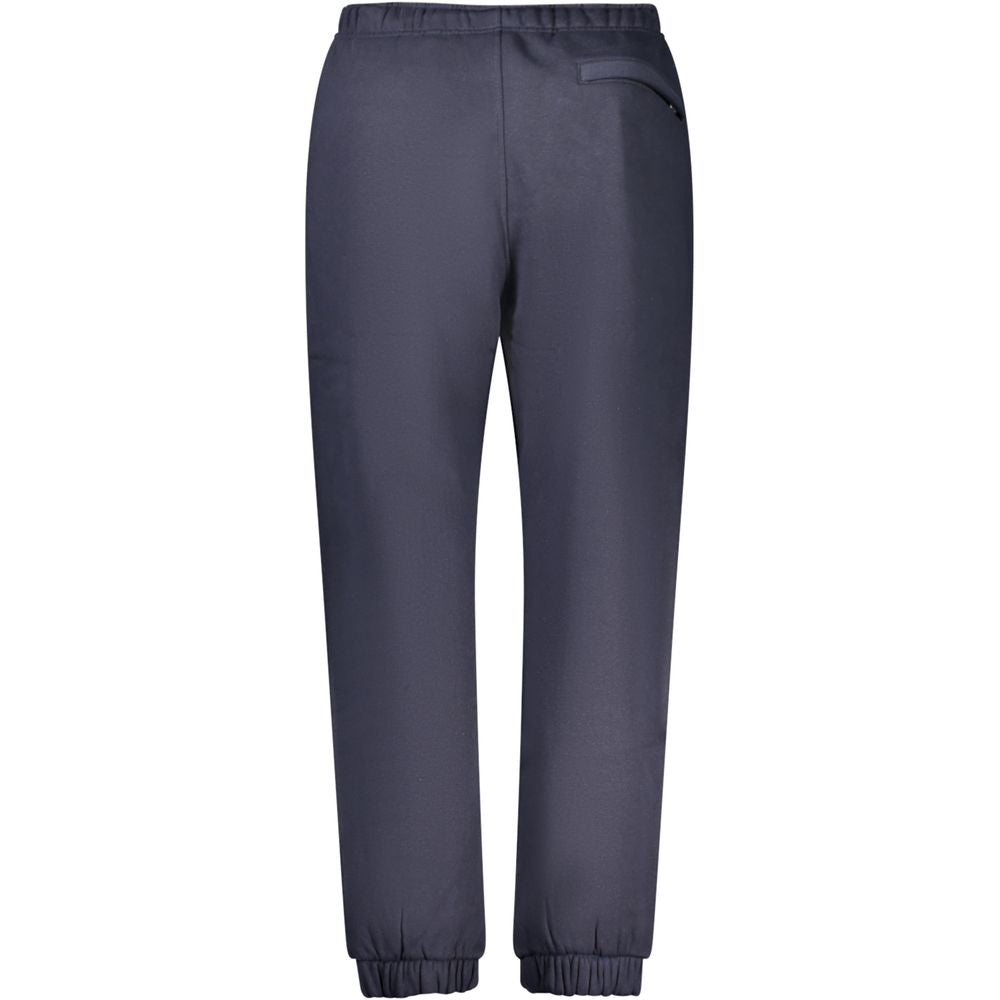 Blue cotton men's track pants by Guess Jeans featuring an athletic fit and casual design, with side pockets and elastic waistband.
