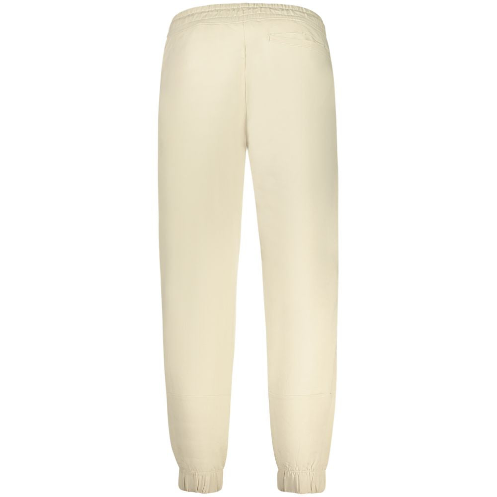 Beige cotton men's sweatpants by Guess Jeans, relaxed fit with elastic waistband and side pockets, casual and comfortable apparel.