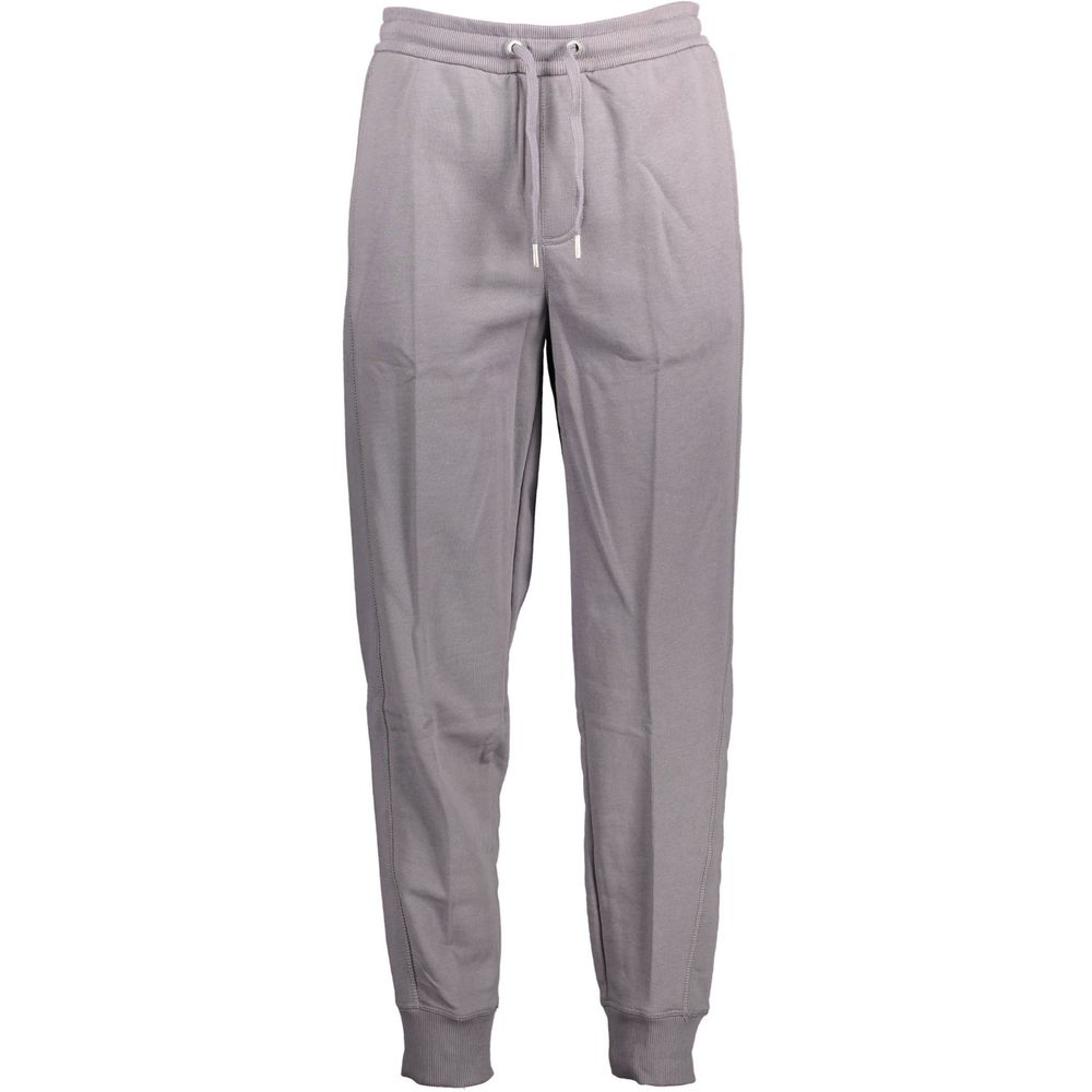 Calvin Klein Grigio cotton men's sport trousers with a relaxed fit and elastic waistband, displayed on a model.
