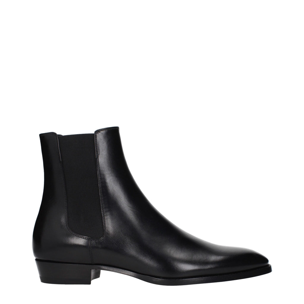 Black leather ankle boots by Celine featuring a sleek design and pointed toe, perfect for stylish everyday wear.