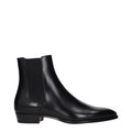 Black leather ankle boots by Celine featuring a sleek design and pointed toe, perfect for stylish everyday wear.