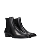 Black leather ankle boots by Celine with sleek design, pointed toes, and low block heels, perfect for stylish everyday wear.