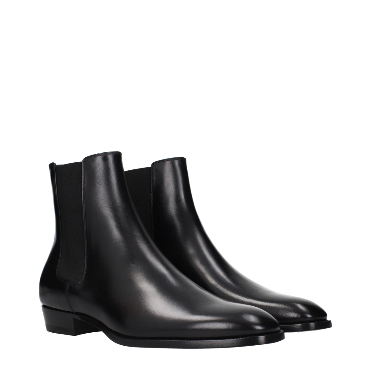 Black leather ankle boots by Celine with sleek design, pointed toes, and low block heels, perfect for stylish everyday wear.