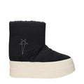 Rick Owens black fabric ankle boots with sleek design and pointed toes, showcasing the stylish footwear detail.