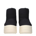 Rick Owens black fabric ankle boots with sleek design and pointed toes, shown on a plain background.