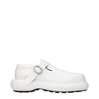 Jil Sander white leather slip-on loafers with sleek design and minimal detailing, perfect for elegant casual wear.