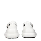 White leather slip-on loafers by Jil Sander, featuring sleek design and minimalistic style, shown on a clean background.