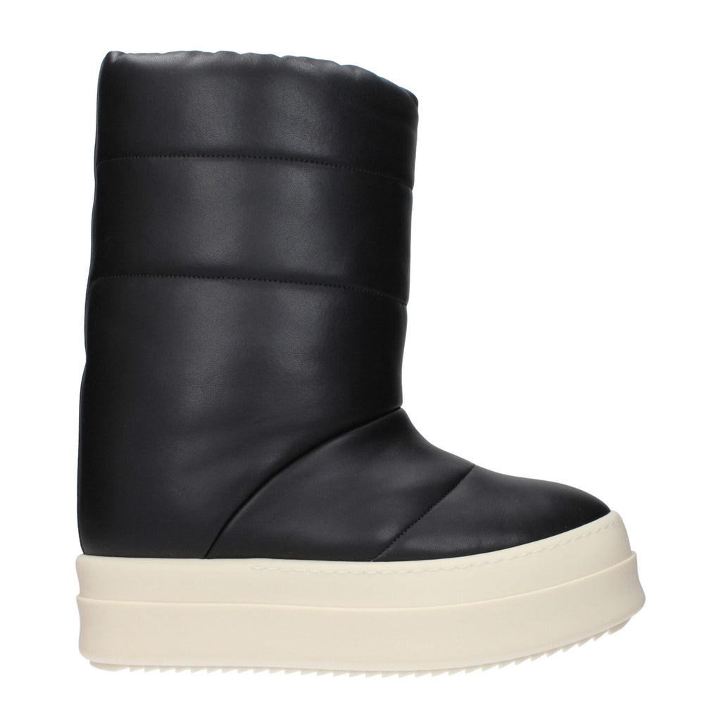 Rick Owens black leather ankle boots with pointed toes and sleek design, showcasing high-quality craftsmanship.