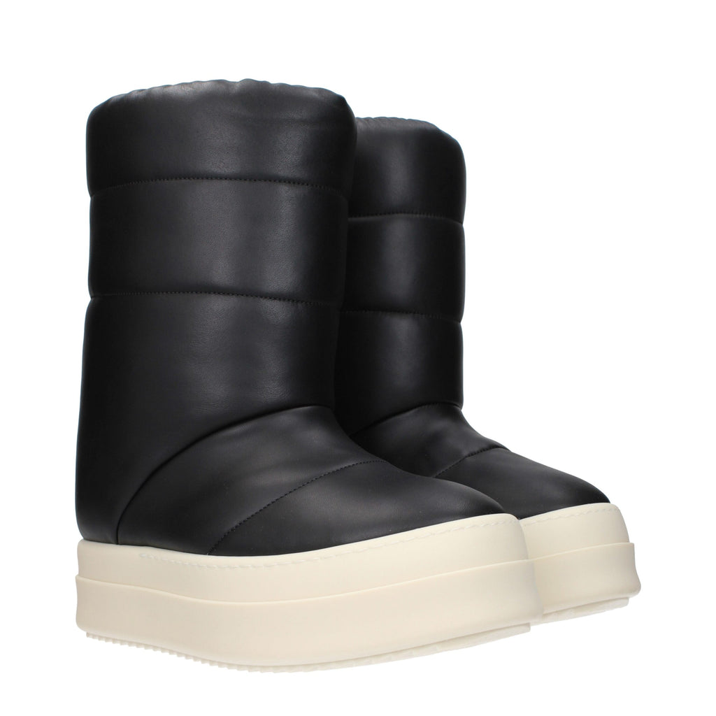 Rick Owens black leather ankle boots with sleek design and pointed toe, showcasing high-quality craftsmanship and modern style.