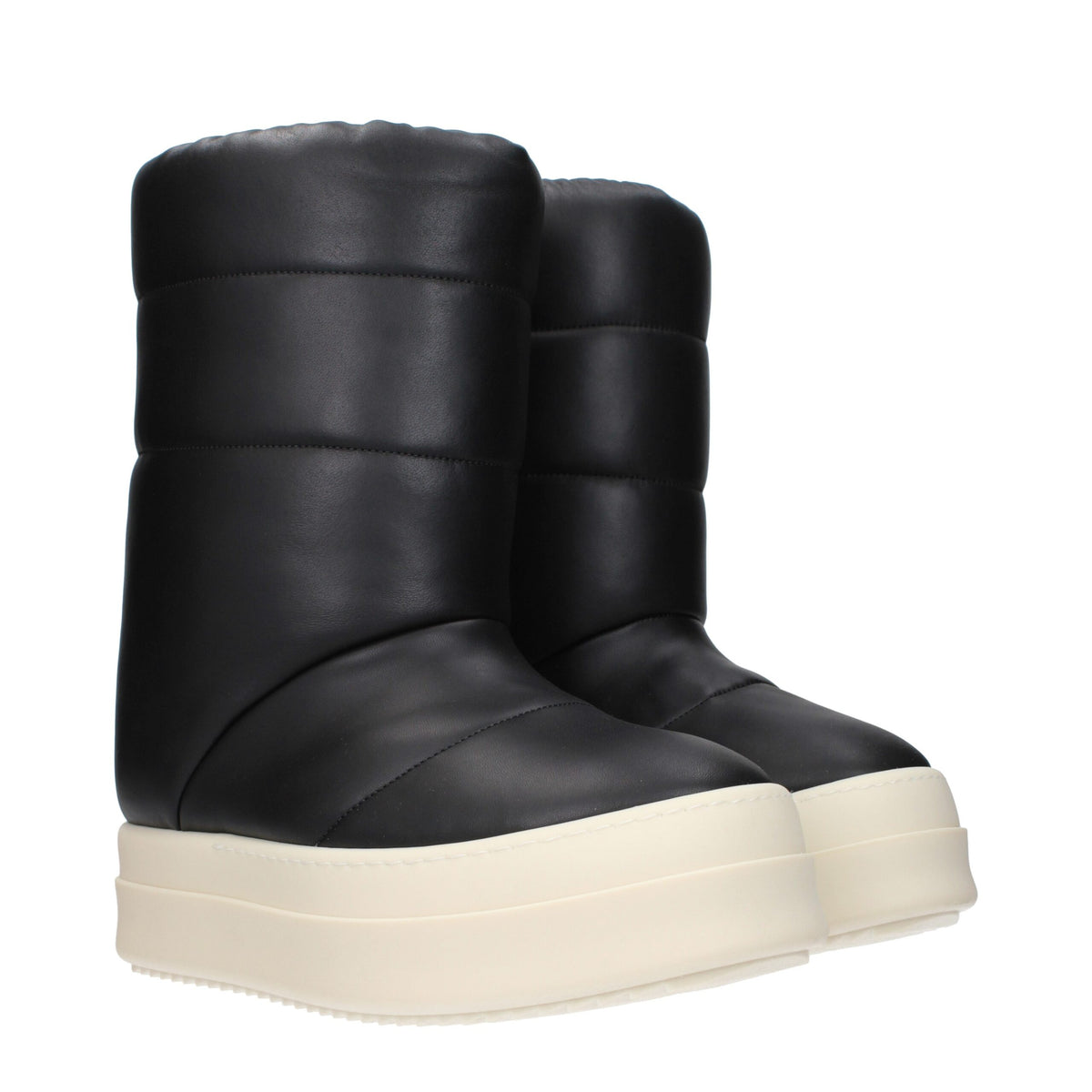 Rick Owens black leather ankle boots with sleek design and pointed toe, showcasing high-quality craftsmanship and modern style.