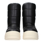 Black leather ankle boots by Rick Owens featuring sleek design and pointed toes, perfect for modern fashion styles.