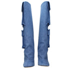 Light blue fabric boots by The Attico with pointed toes and block heels, showcased on a neutral background.