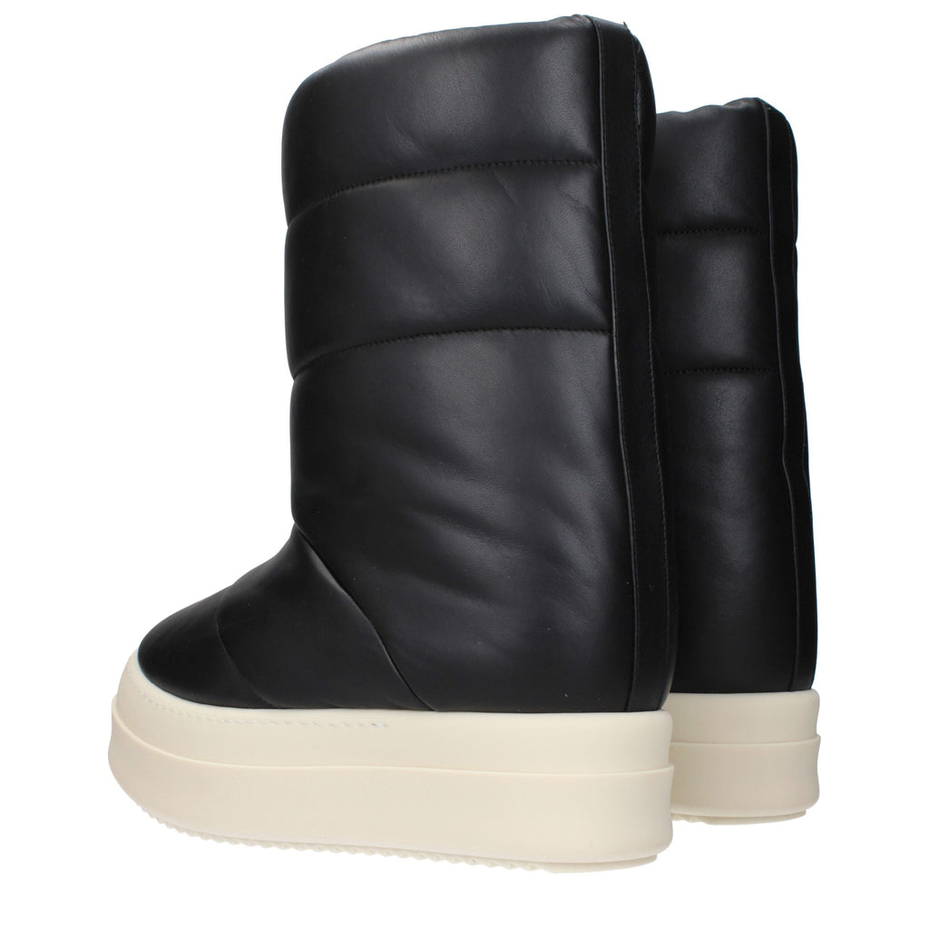 Rick Owens black leather ankle boots with sleek design and pointed toes, stylish footwear for modern fashion.