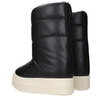Rick Owens black leather ankle boots with sleek design and pointed toes, stylish footwear for modern fashion.