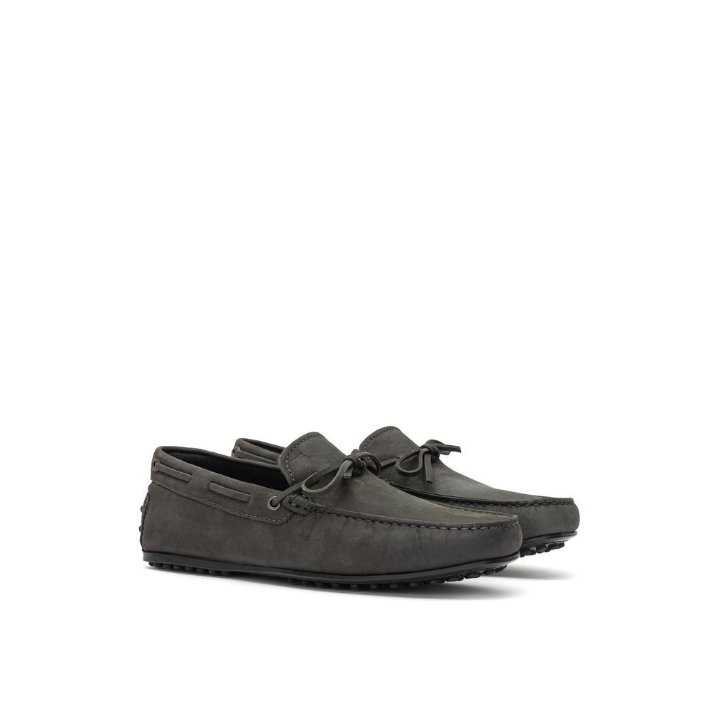 Gray nubuck leather moccasins by Tod's featuring classic stitching and slip-on design.